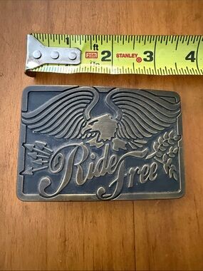 Metal “Ride Free” rectangular belt buckle (no belt)